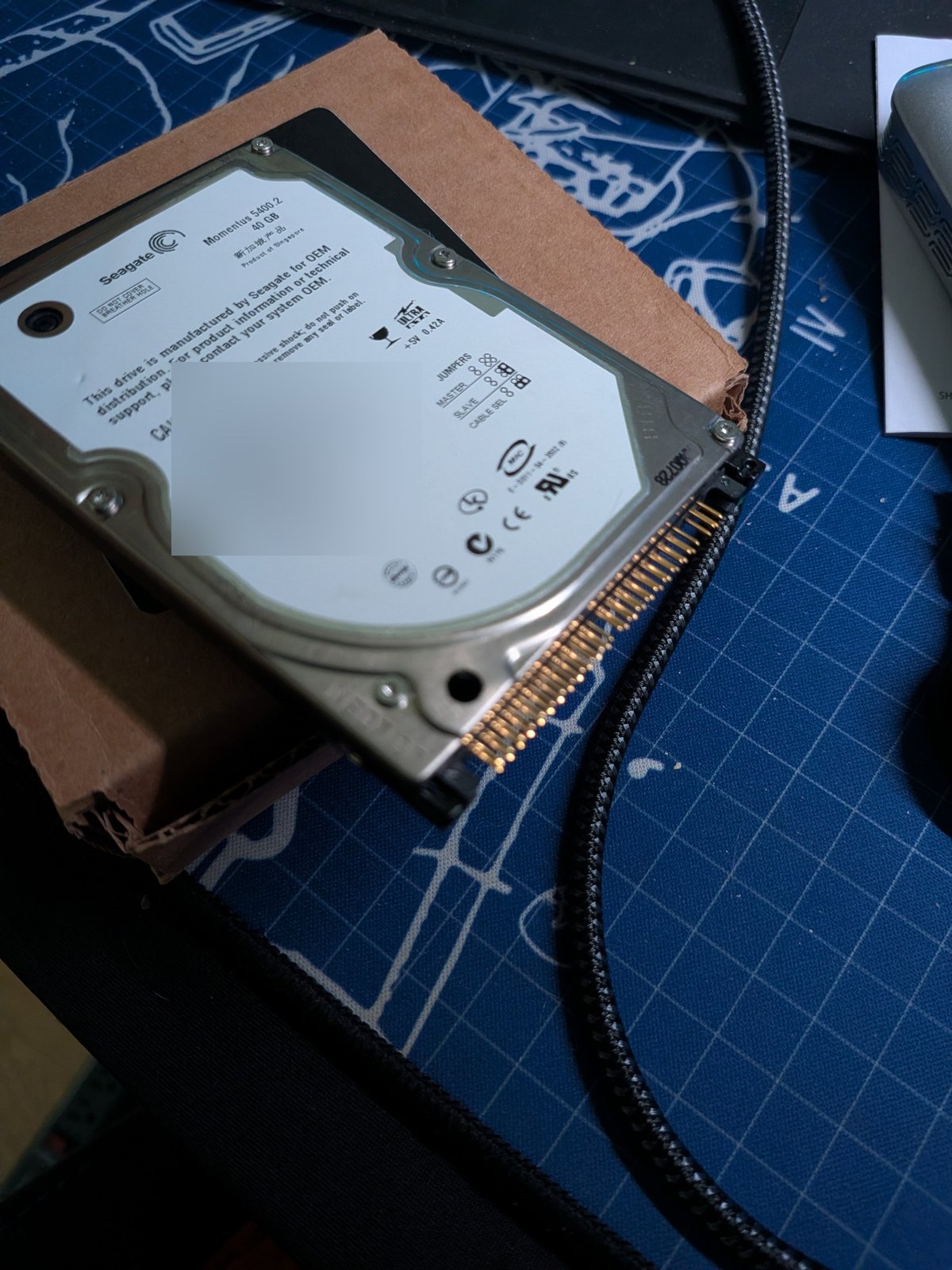 A 2.5-inch drive from the set One of the seven, on the box it arrived in.